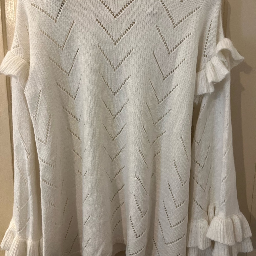 Flared ruffle trimmed sweater